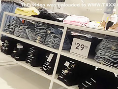 Candid voyeur teen in cheeky shorts clothes shopping