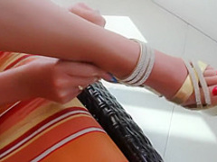 Amateur blonde girl gives a footjob