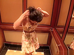 Big tit Asian MILF fucks behind the scenes