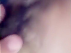 Showing her tits and wet hairy pussy