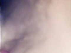 Showing her tits and wet hairy pussy