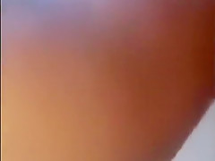 Showing her tits and wet hairy pussy