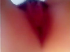 Showing her tits and wet hairy pussy