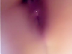 Showing her tits and wet hairy pussy