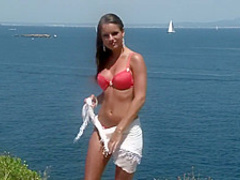 Hot babe strips on a cliff with a great view