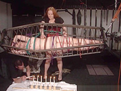 American goddess Carolina Pierce caged and spanked