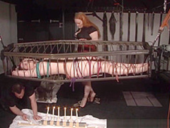 American goddess Carolina Pierce caged and spanked