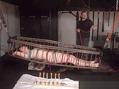 American goddess Carolina Pierce caged and spanked