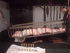 American goddess Carolina Pierce caged and spanked