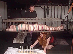 American goddess Carolina Pierce caged and spanked