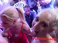 Racy blonde milf in erotic lingerie and stockings is having group sex on the stage