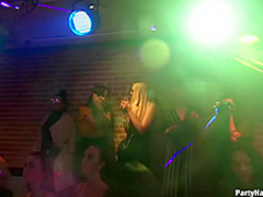 Naughty girls are taking turns sucking a handsome dancer's dick and getting fucked in the night club