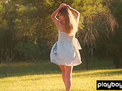 All natural teen Lillii stripping slowly on a meadow