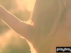 All natural teen Lillii stripping slowly on a meadow