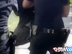 Black criminal is arrested by two horny MILFs with big tits and round ass