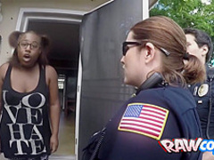 Black criminal is arrested by two horny MILFs with big tits and round ass