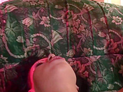 Vulgar bitch is in a doggy position, while her husband is putting her sex toy in her pussy