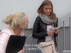 Two kinky girls are kneeling on the floor and sharing their friend’s huge, fat cock