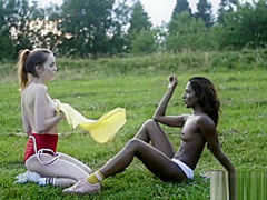 Tiny titted ebony and ivory teens stripping outdoor