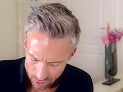 Incredible babe in a blue dress, Katy Rose is under the table and sucking her lover’s big dick