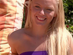 This young blonde slut masturbates outside