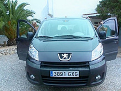 Two young lesbians have fun on the car