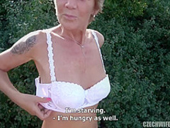 Handsome man is having wild sex with a mature blonde lady, in a local forest