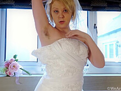 This wife masturbates in her dress