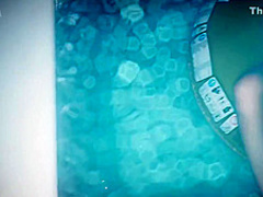 She rubs her pussy in the swimming pool