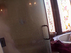 Two women masturbating in the shower