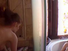 Two women masturbating in the shower