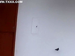 Small titted woman is kneeling on the floor and sucking two dicks, like a real pro