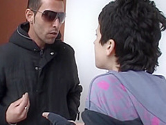 Small titted woman is kneeling on the floor and sucking two dicks, like a real pro