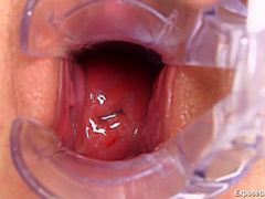 Busty blonde nurse in red shoes with high heels is playing with gyno equipment and a huge dildo