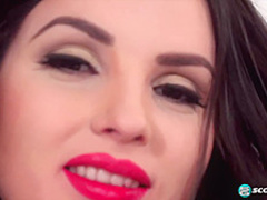 Brunette with big, saggy tits, Talia is posing topless in front of the camera, for cash