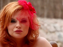 Red haired beauty, Tarra White is wearing corset and stockings while masturbating on the floor