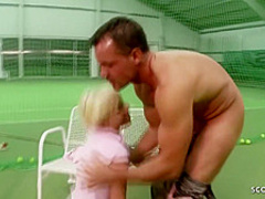 Frisky blonde chick is giving a blowjob to her tennis trainer and rubbing her perfectly shaved pussy