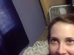 A young brunette with a dick in her mouth