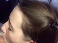 A young brunette with a dick in her mouth