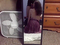 A young brunette with a dick in her mouth