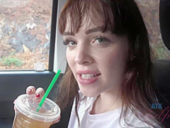 Frisky brunette with full, sensual lips is smoking in the car and spreading her legs wide open