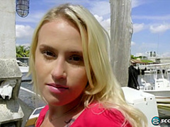A beautiful blonde teen masturbating in bed