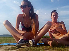 Two lesbian babes have fun together outdoors