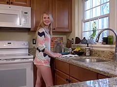 Lily Rader is using a cucumber as a sex toy while masturbating in the kitchen