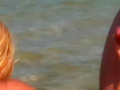 Two Handsome Men Are About To Fuck A Delightful Blonde On The Beach, During The Day