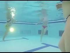 college girl gives handjob in public pool